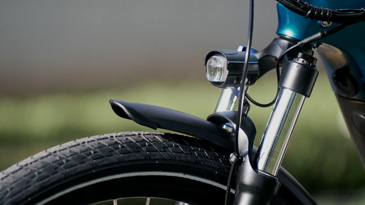 Integrated headlight and suspension fork
